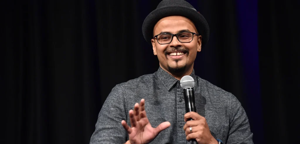 Indian stand-up comedian Sorabh Pant performing on stage with a microphone