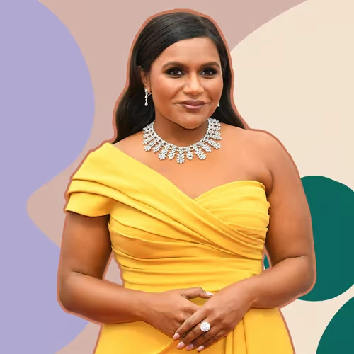 mindy-kaling-comedian-writer-producer Mindy Kaling, acclaimed comedian, writer, and producer, wearing a yellow dress and diamond necklace