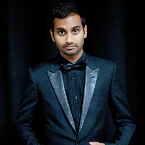aziz-ansari-standup-comedian-actor American comedian and actor Aziz Ansari wearing a black tuxedo with a bow tie