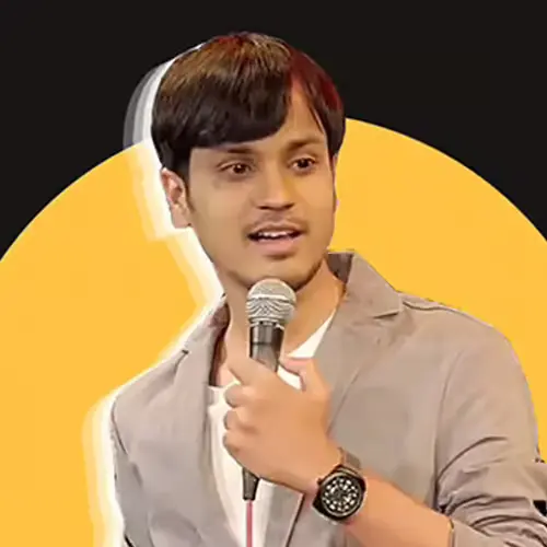 Comedian Piyush Sharma holding a microphone and speaking, set against a circular yellow background