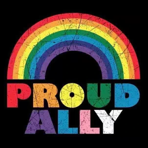 A colorful graphic featuring three raised hands with a heart on each palm, set against a rainbow background with the text "Pride: Support Your Friends."