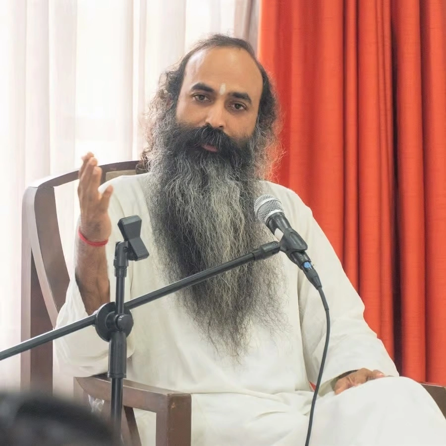 Sri Anish speaking at a corporate leadership event or retreat