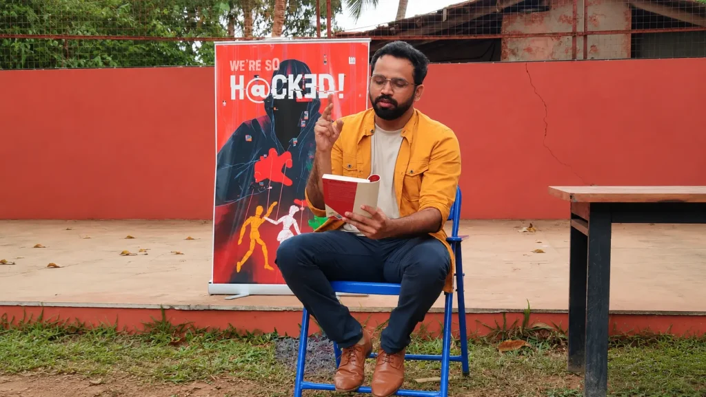 Gautam Mayekar reading his cyber thriller book We Are So Hacked during an engage4more corporate session