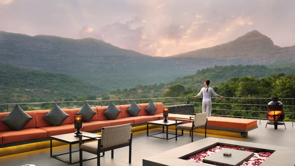 Luxury outdoor seating area at Hilton Shillim Estate overlooking the Sahyadri mountains, ideal for executive strategy offsites and wellness retreats