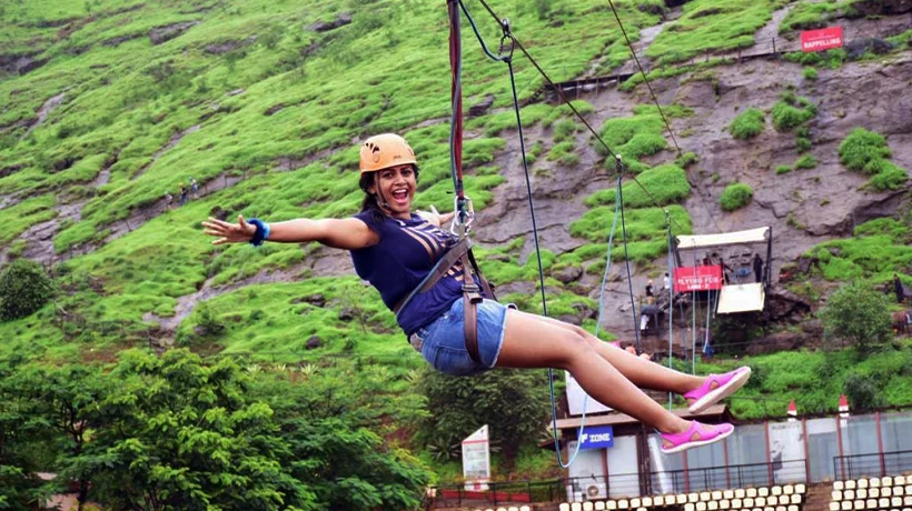 A corporate employee enjoying a high-energy zipline activity at Flipside Adventure Park in the Financial District, Hyderabad