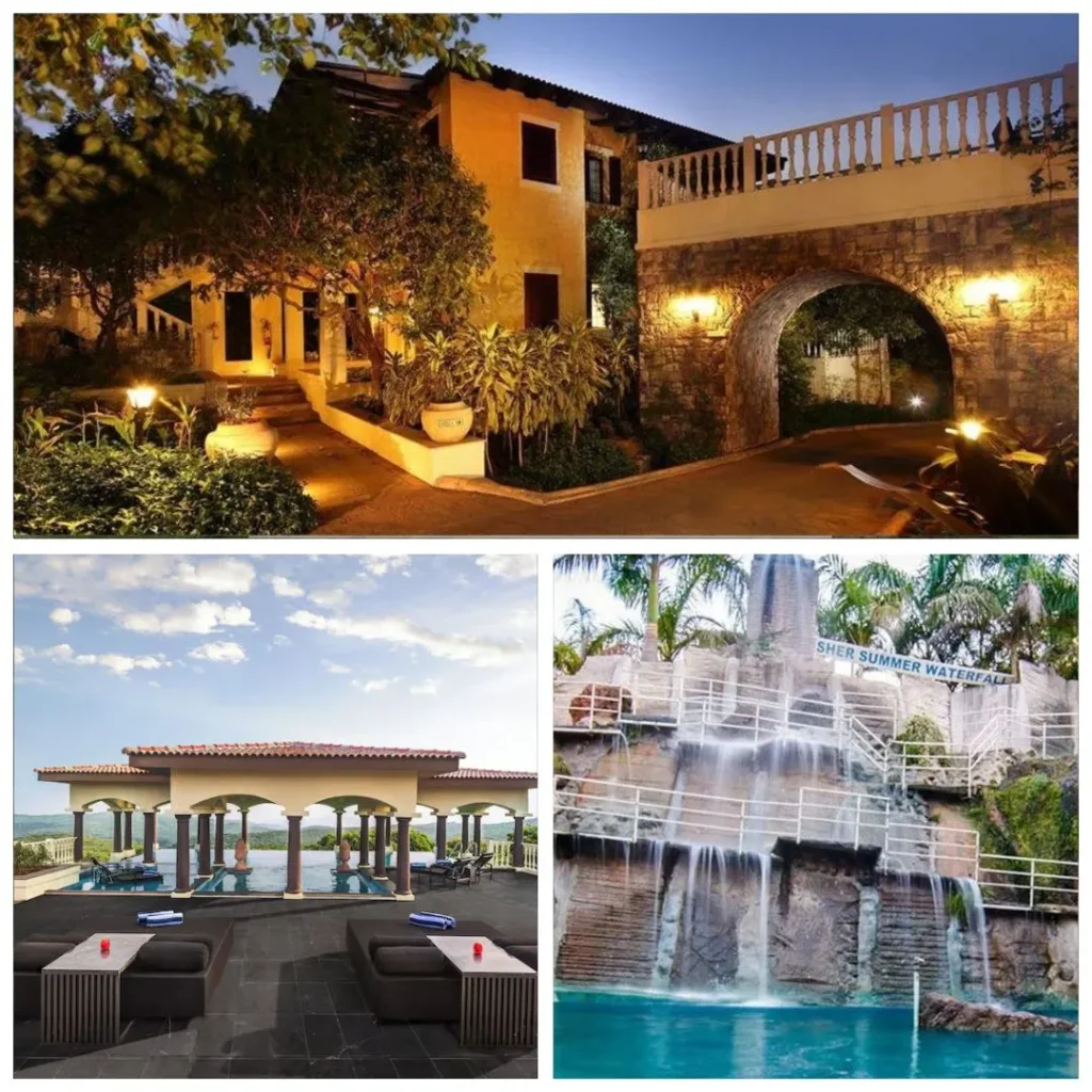 A warm, illuminated evening view of Le Méridien Mahabaleshwar showing a grand stone archway and Mediterranean-style villas nestled among lush trees