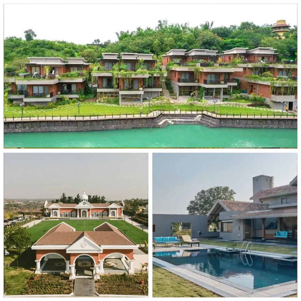 A high-angle view of multi-story brick and glass eco-villas with rooftop gardens at Grape County, situated along a turquoise lake in Nashik