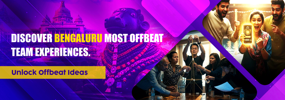 Corporate team members building structures and collaborating on offbeat group experiences in Bengaluru with Vidhana Soudha landmark