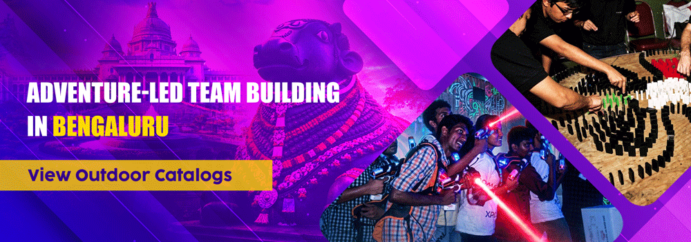Corporate outdoor adventure activities in Bengaluru featuring laser tag and domino team challenges with Vidhana Soudha backdrop