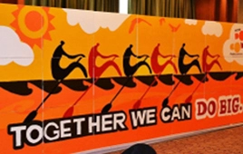 the-big-picture-team-building-activity-engage4more A large-scale completed corporate mural titled "Together We Can Do Big," showing silhouetted rowers in a boat, symbolizing team synergy.