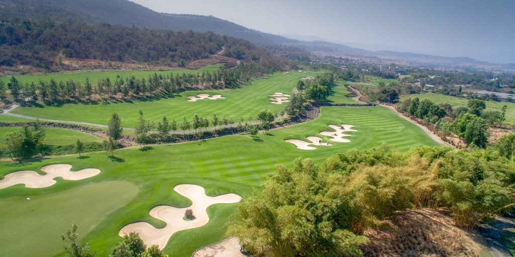 Aerial view of the championship golf course and private valley at Oxford Golf Resort in Lavale, a premier venue for Hinjewadi corporate team building
