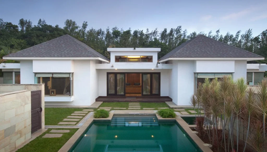 Night view of The Serai Chikmagalur resort architecture, a top destination for corporate coffee plantation retreats near Bengaluru