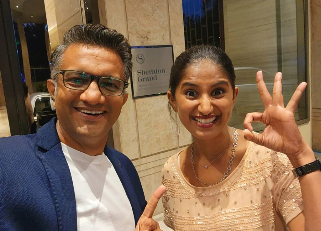engage4more founder Nishant Parashar posing with a stand-up comedian at the Sheraton Grand, representing the company's deep expertise in corporate event entertainment