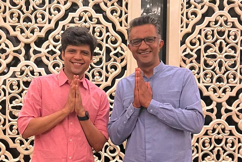 engage4more founder Nishant Parashar standing with a professional artist in a traditional namaste gesture, highlighting the company's strong professional relationships in the entertainment industry